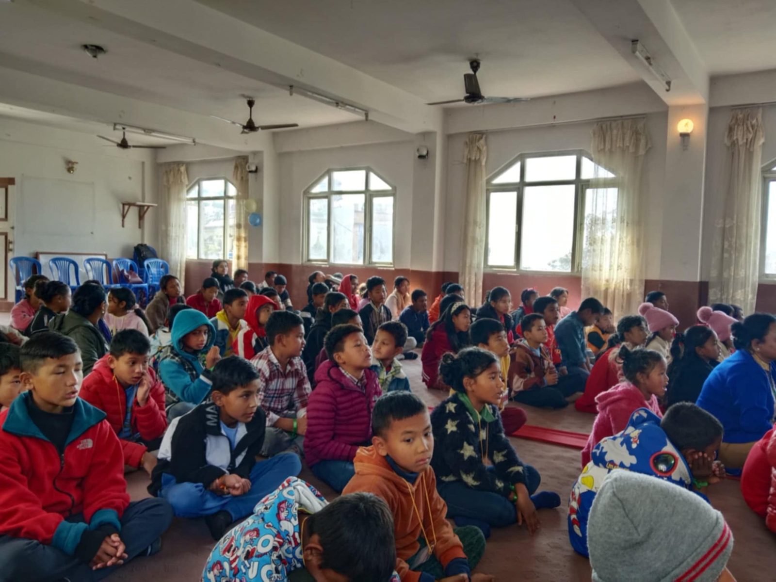 Children waiting together for a Mission SU event to begin
